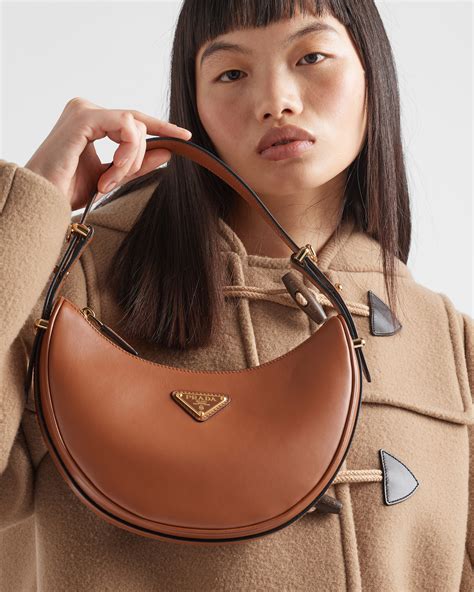 prada arque cognac|Cognac/natural Prada Arqué Small Shearling Shoulder Bag.